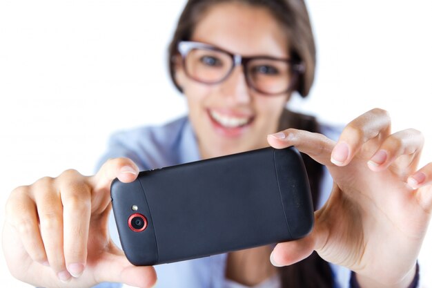 Cute brunette woman taking photo of herself