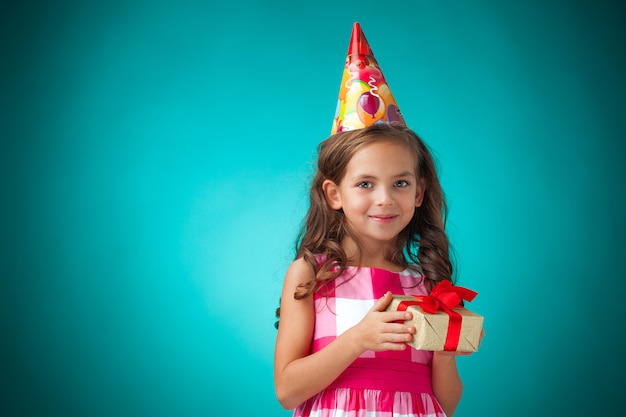 cute cheerful little girl on blue