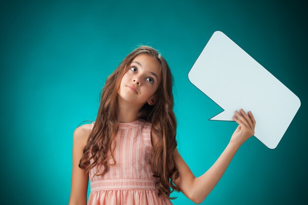 The cute cheerful little girl with speech bubble