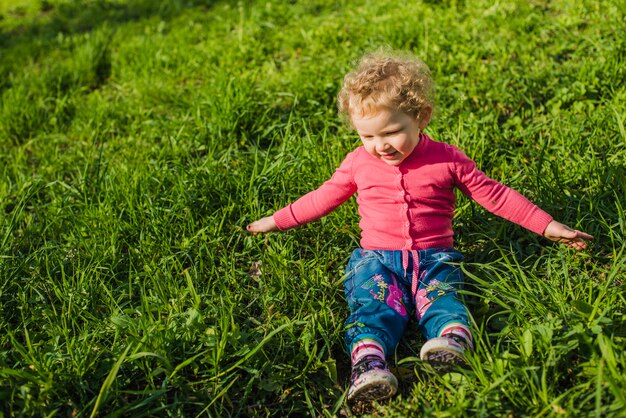 Cute child enjoying in the grass