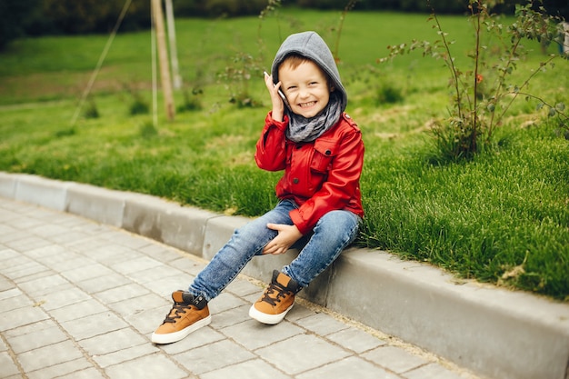 Cute child in a park playing on a grass