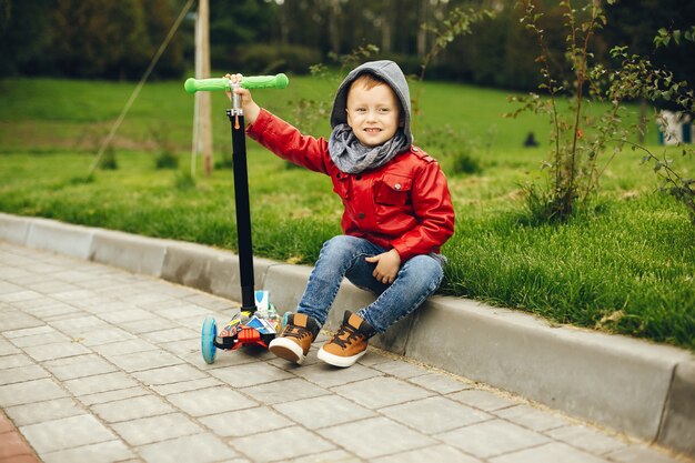 Cute child in a park playing on a grass