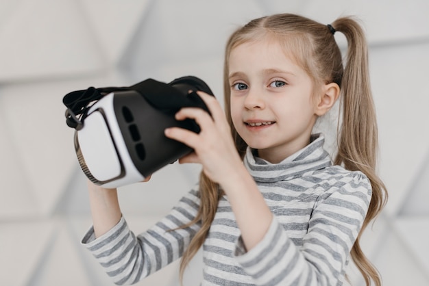 Cute child using virtual reality headset