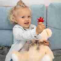 Free photo cute child with toy at home during quarantine