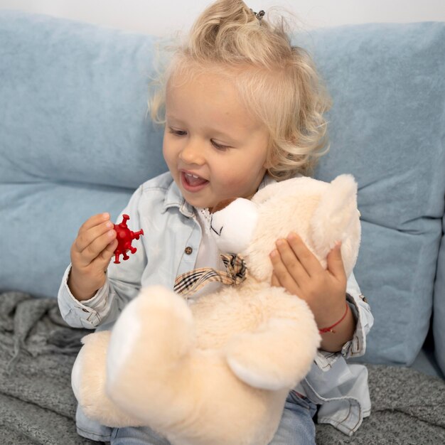 Cute child with toy at home during quarantine