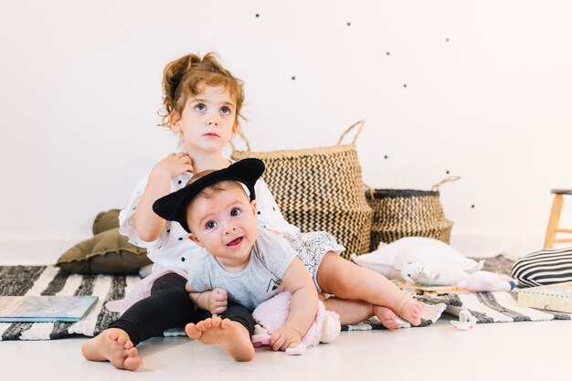 Cute children on striped rag