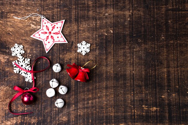 Cute christmas ornaments on wooden background with copy space