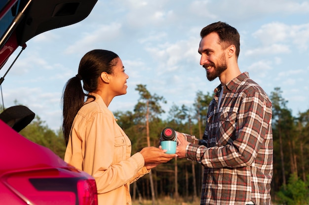 Cute couple enjoying a cup of hot coffee