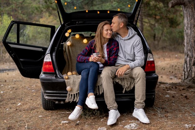 Cute couple enjoying road trip together