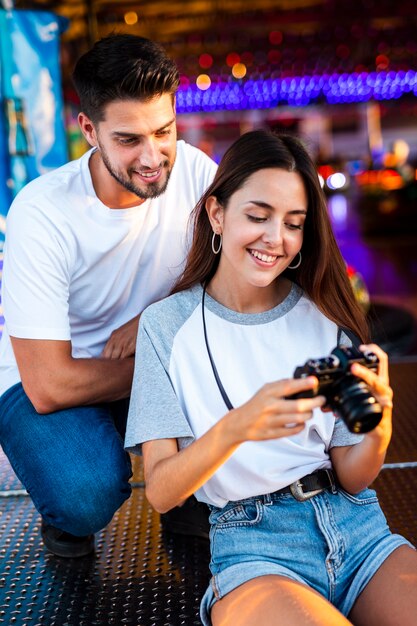 Cute couple at fair looking at camera