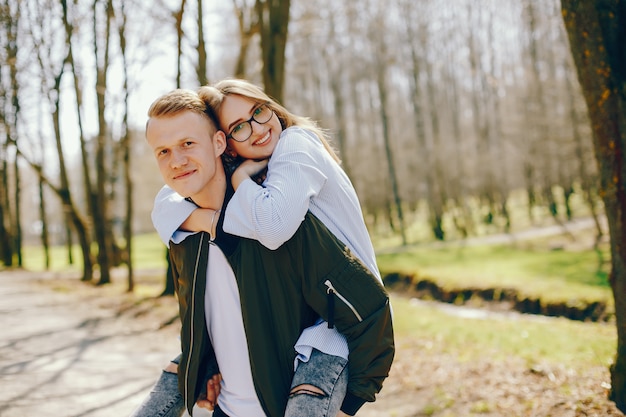 Free photo cute couple in a forest