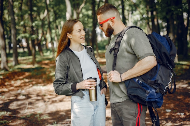 Cute couple have a rest in a forest