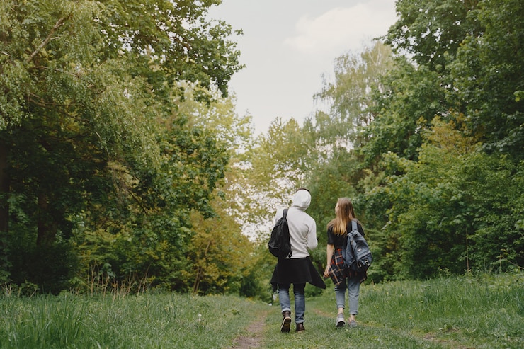 Free Photo cute couple have a rest in a summer forest
