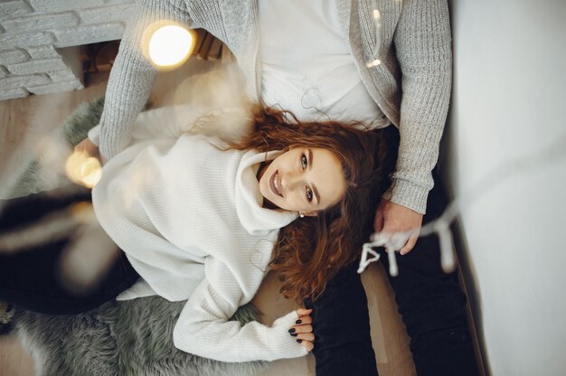 Cute couple at home in a warm sweaters