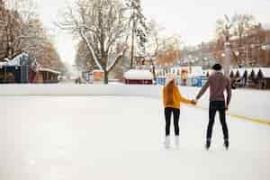 Free photo cute couple in a ice arena