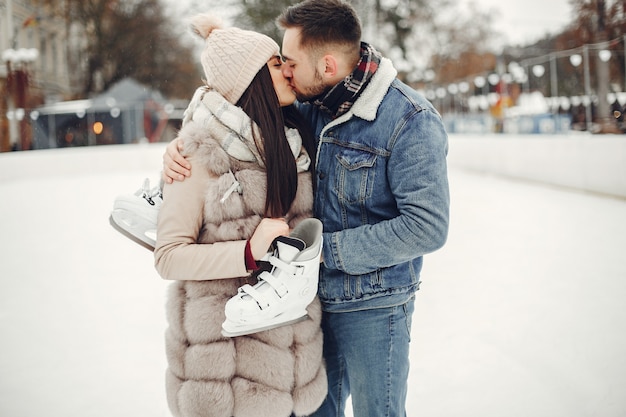 Free photo cute couple in a ice arena