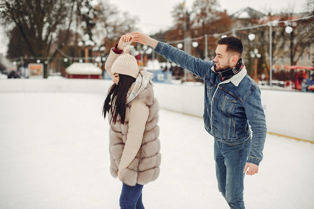 Free photo cute couple in a ice arena