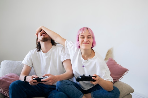 Free photo cute couple playing together a video game