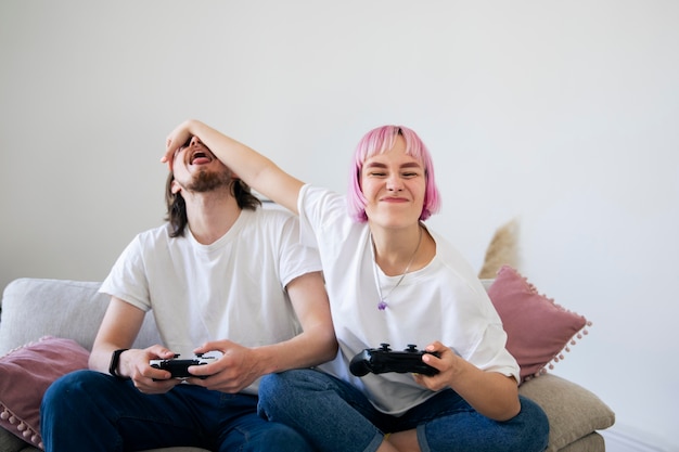 Cute couple playing together a video game