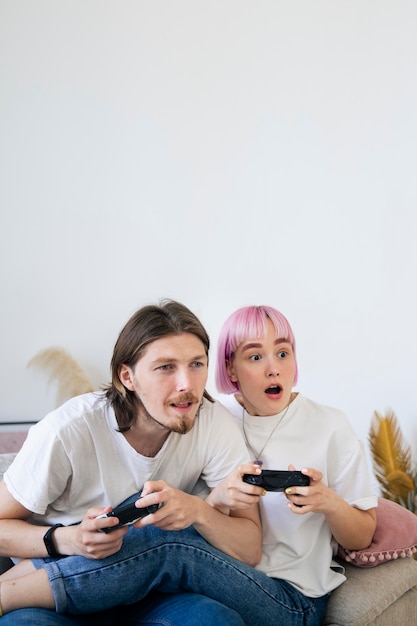 Cute couple playing together a video game