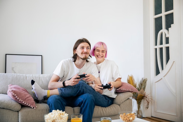 Cute couple playing together a video game