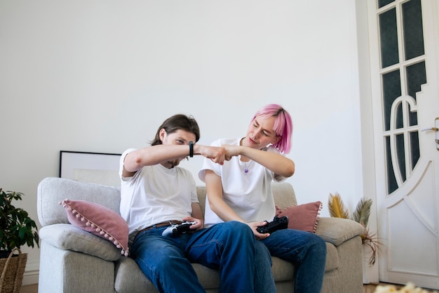 Cute couple playing videogames indoors