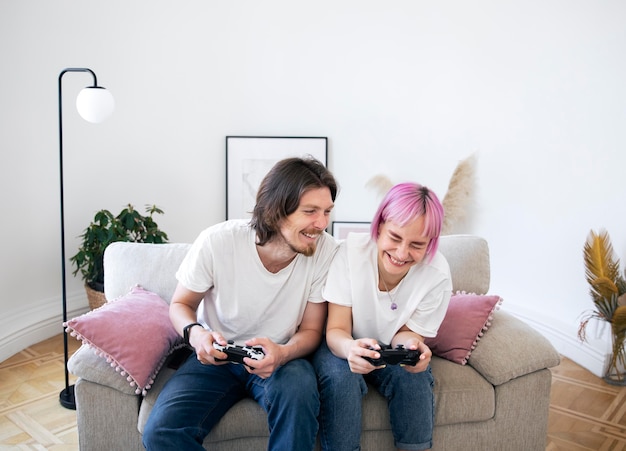 Cute couple playing videogames indoors