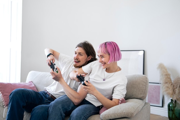 Free photo cute couple playing videogames