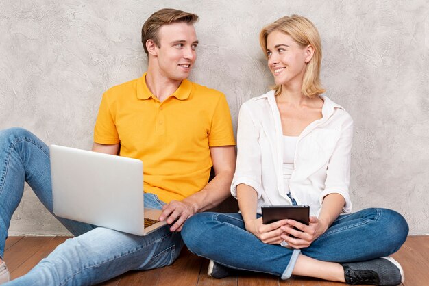 Cute couple sitting and looking at each other