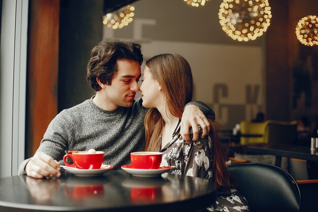 Cute couple spend time in a cafe