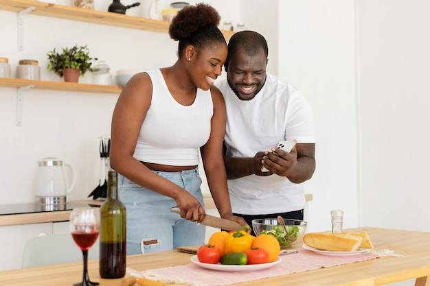 Free photo cute couple staying in the kitchen