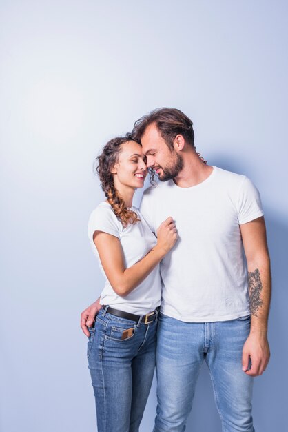 Cute couple in white hugging