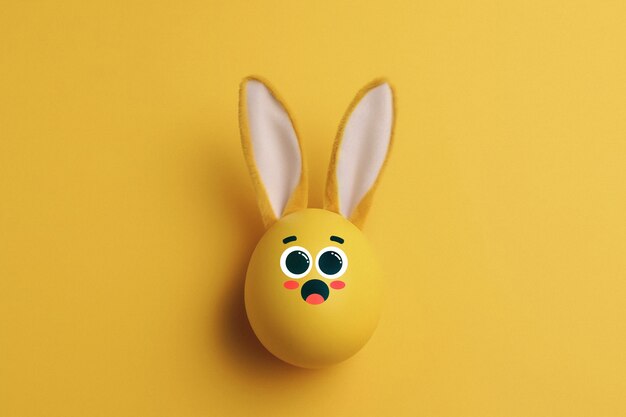 Cute easter egg with yellow background