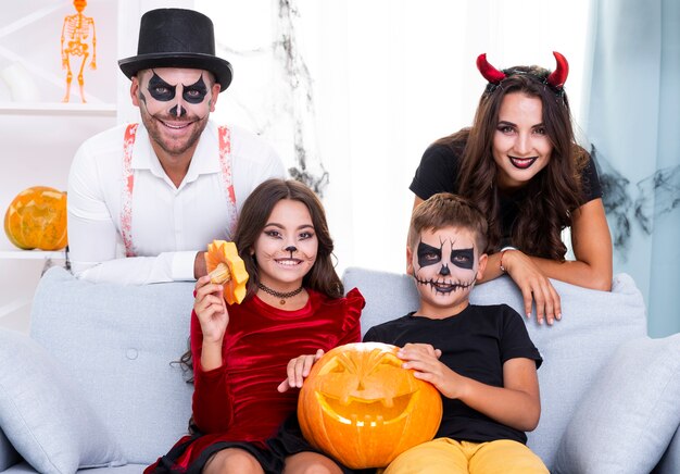 Cute family gathered together for halloween