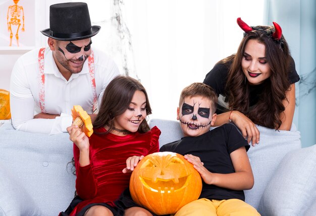 Cute family gathered together for halloween