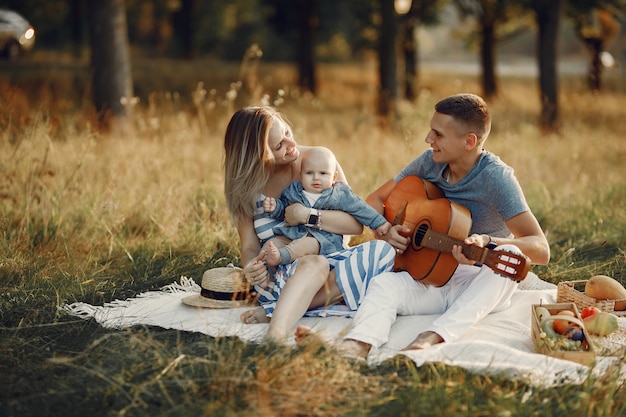 Free photo cute family playing in a autumn field