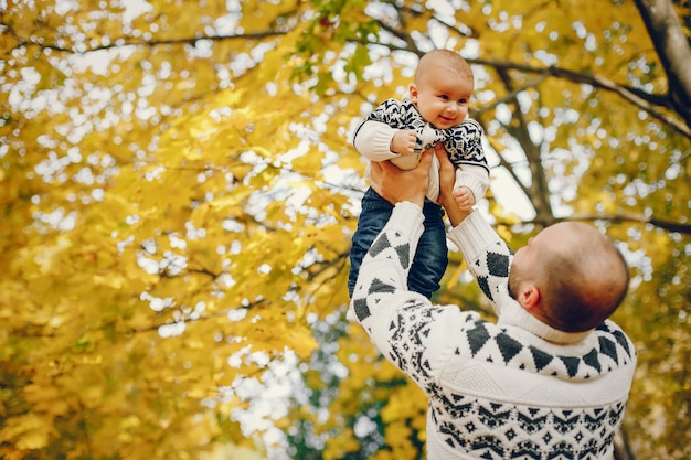 Cute family playing in a autumn park