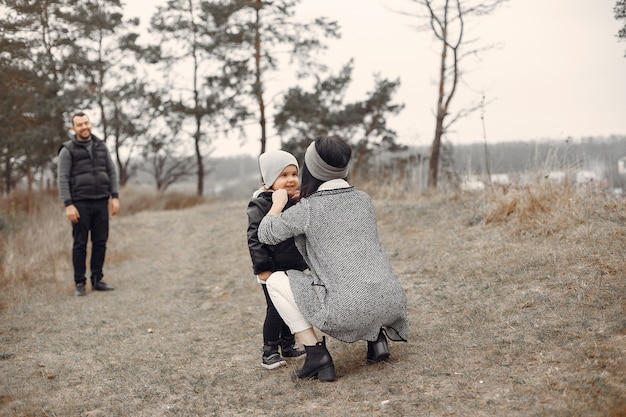 Cute family playing in a spring forest