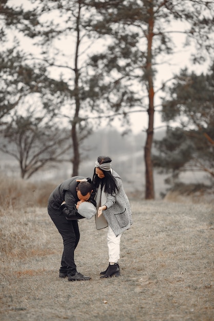 Free photo cute family playing in a spring forest