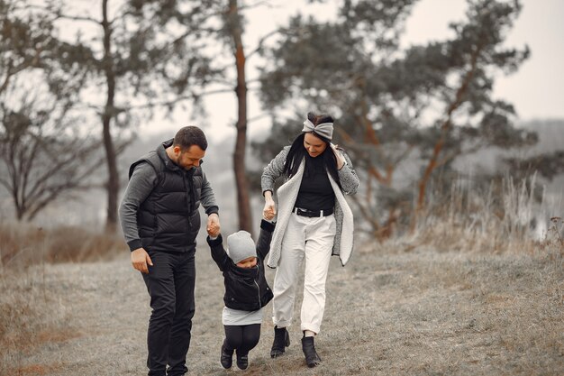 Cute family playing in a spring forest