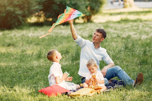 Cute family playing in a summe field