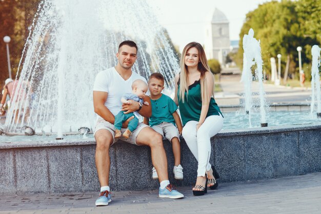 Cute family playing in a summer city