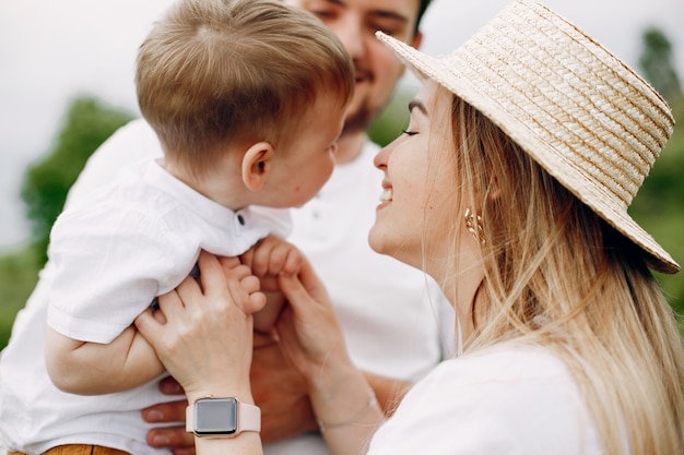 Cute family playing in a summer field