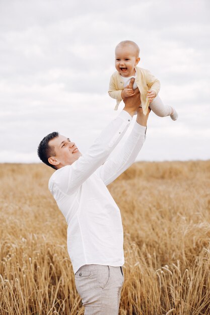 Cute family playing in a summer field