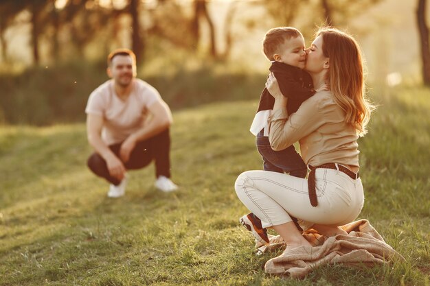 Cute family playing in a summer field