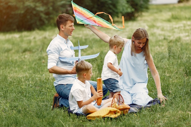 Cute family playing in a summer field