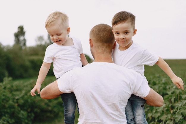 Cute family playing in a summer field