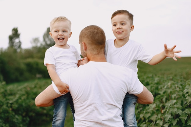 Cute family playing in a summer field