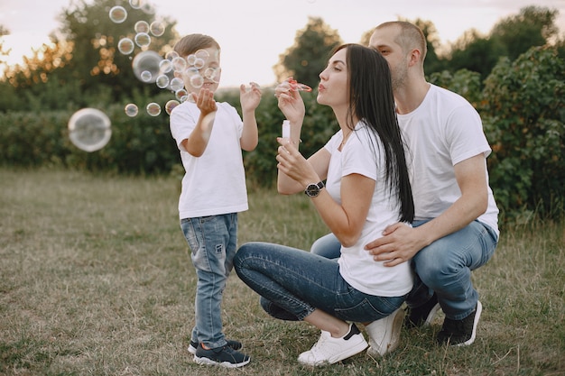 Cute family playing in a summer field