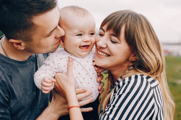 Cute family playing in a summer park